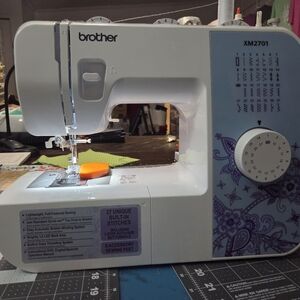 Brother Sewing Accessories with Pink and White Tools